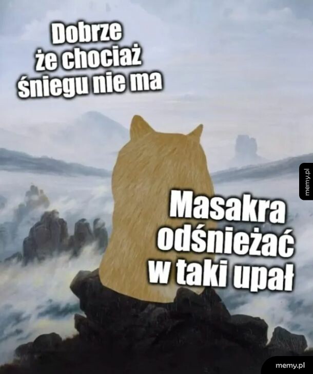 Postać w kształcie kota na tle górskiego krajobrazu.